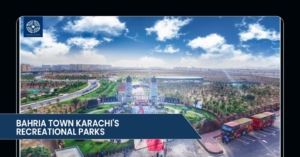 Aerial view of Bahria Town Karachi's recreational parks featuring lush greenery, pathways, and event space under a vibrant blue sky.